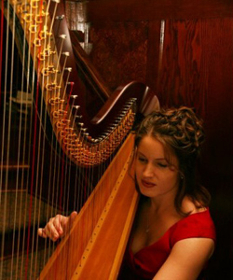 Melanie playing harp